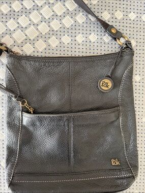 The Sak Black Pebbled Leather Shoulder Bag with Gold Accents